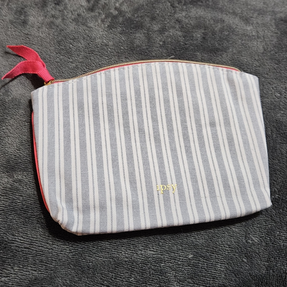 Empty Blue and White Ipsy Small Cosmetics Bag with Red zipper pull